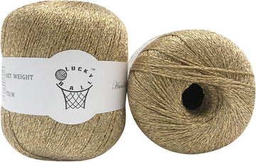 Gold metallic fancy yarn balls labeled Lucky Ball, ideal for knitting or crochet projects